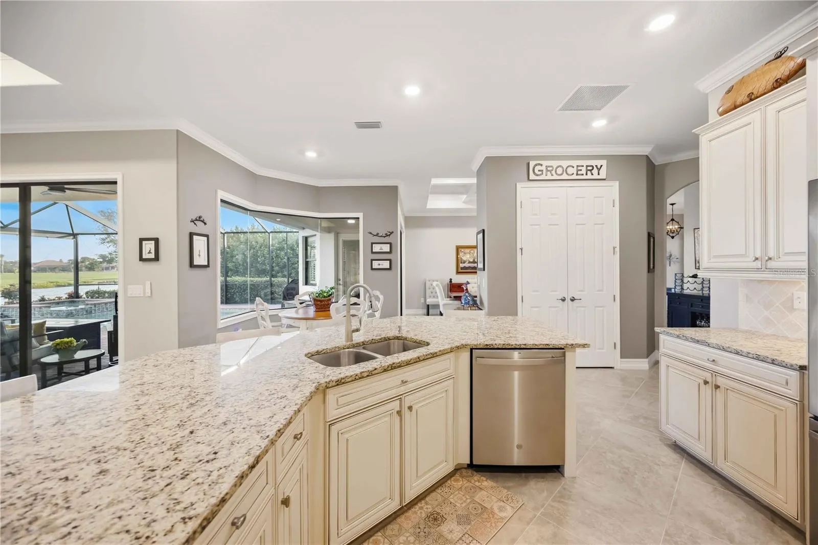 Upscale Kitchen with double ovens, dishwasher, cooktop, plenty of counter space, and dining on the counter.
