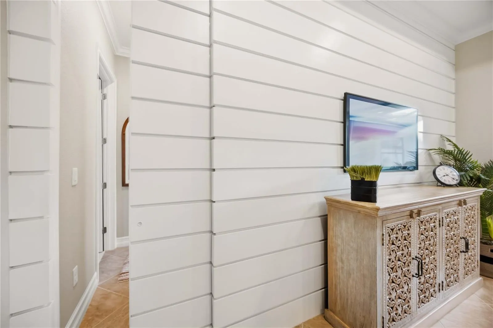Shiplap wall with hidden shiplap pocket door.  Meticulous craftmanship!