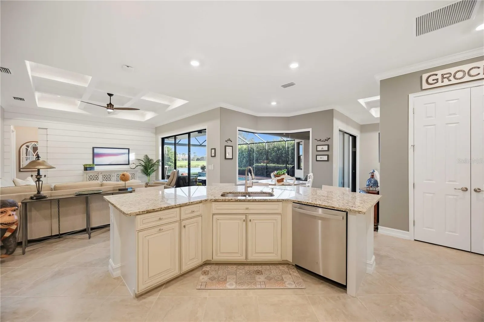 Upscale Kitchen with double ovens, dishwasher, cooktop, plenty of counter space, and dining on the counter.