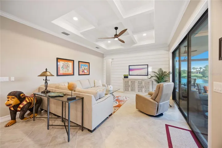 The grid ceiling is custom-made, as is the shiplap wall.  The shiplap wall has a hidden pocket door to go into the guest room/bath at the back of the home.