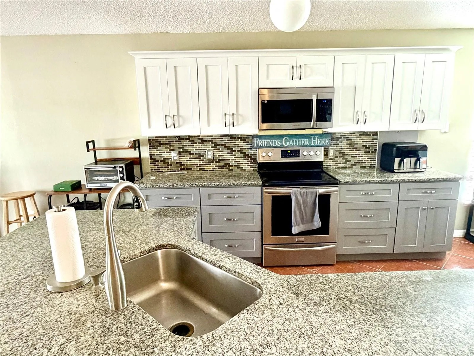 Recent kitchen update- new countertops, cabinets, and appliances