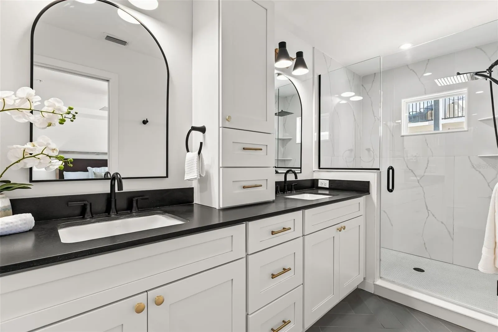 Level Two: Ultra Luxurious Primary en suite bathroom with double vanity sinks.