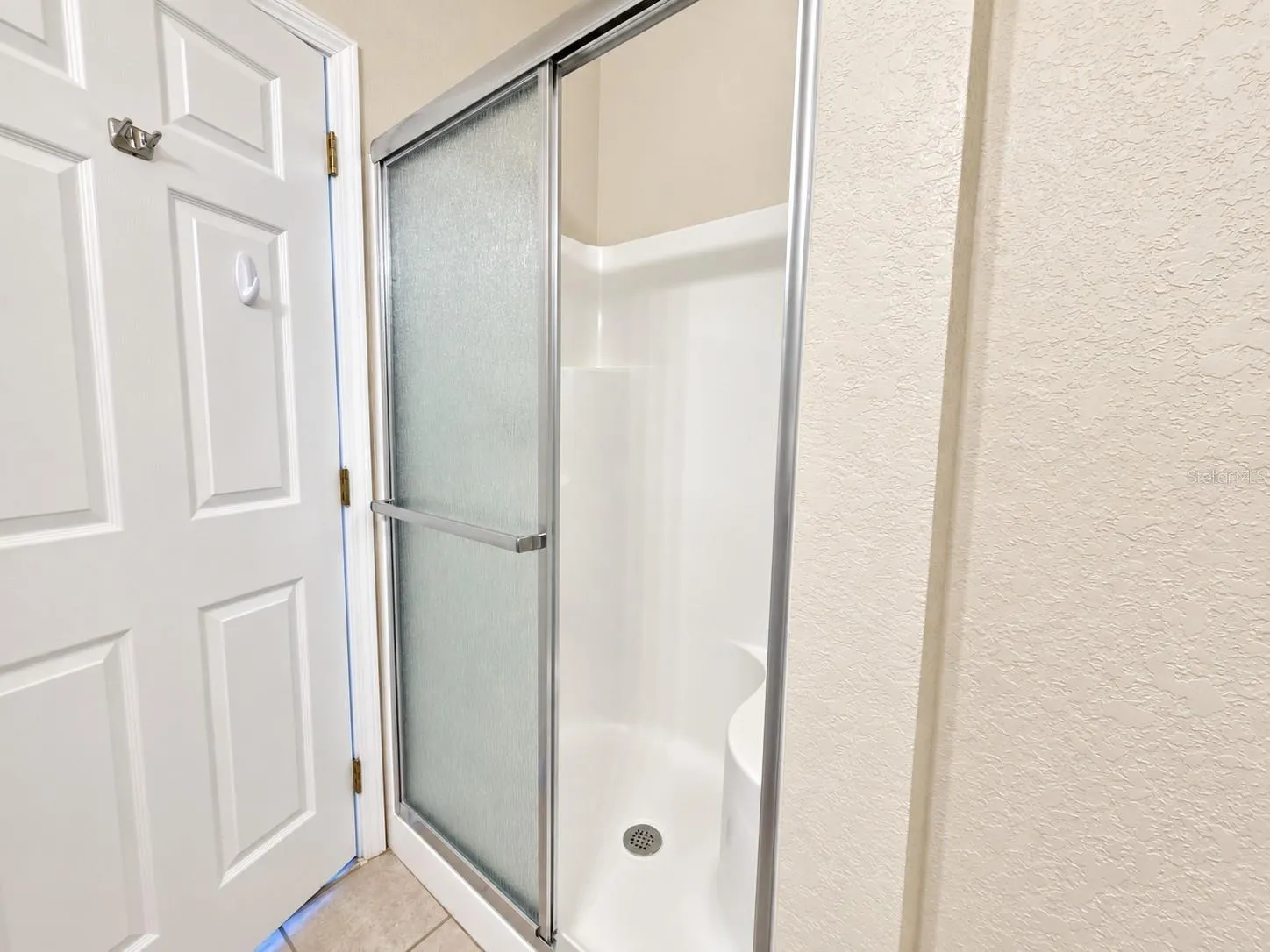 Primary Bathroom - walk-in shower with built in bench