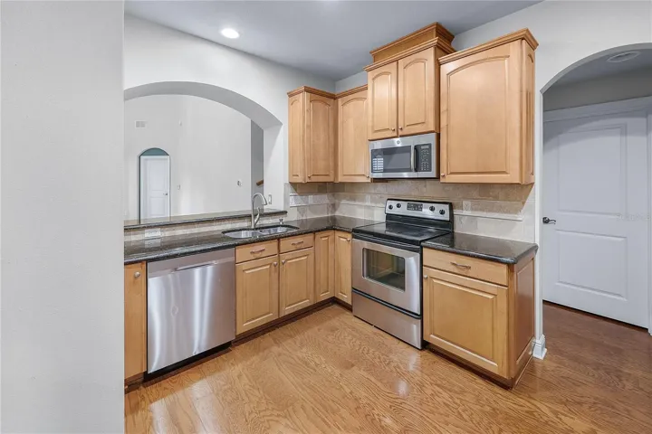 KITCHEN WITH DIRECT VIEW OF LIVING ROOM