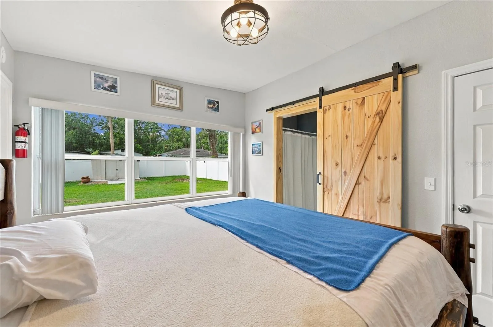 Bedroom 1 with barn door to jack and jill bathroom.