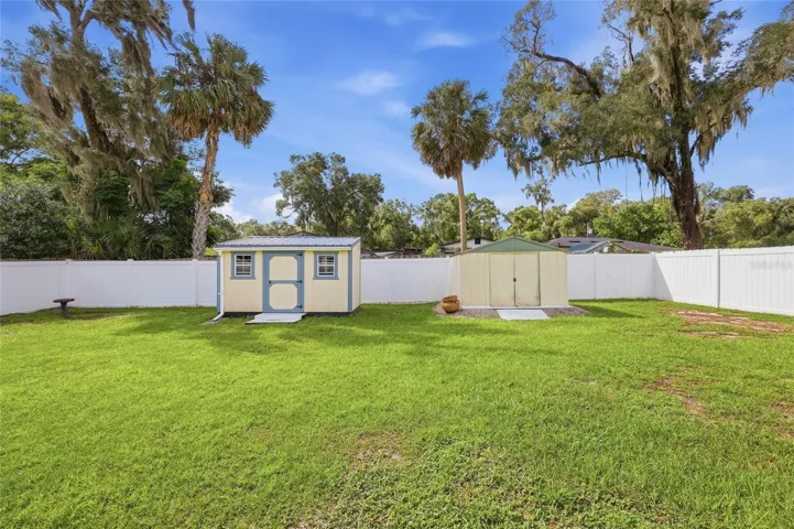 Backyard with storage sheds.