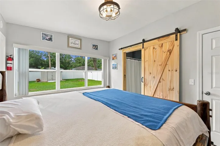 Bedroom 1 with barn door to jack and jill bathroom.