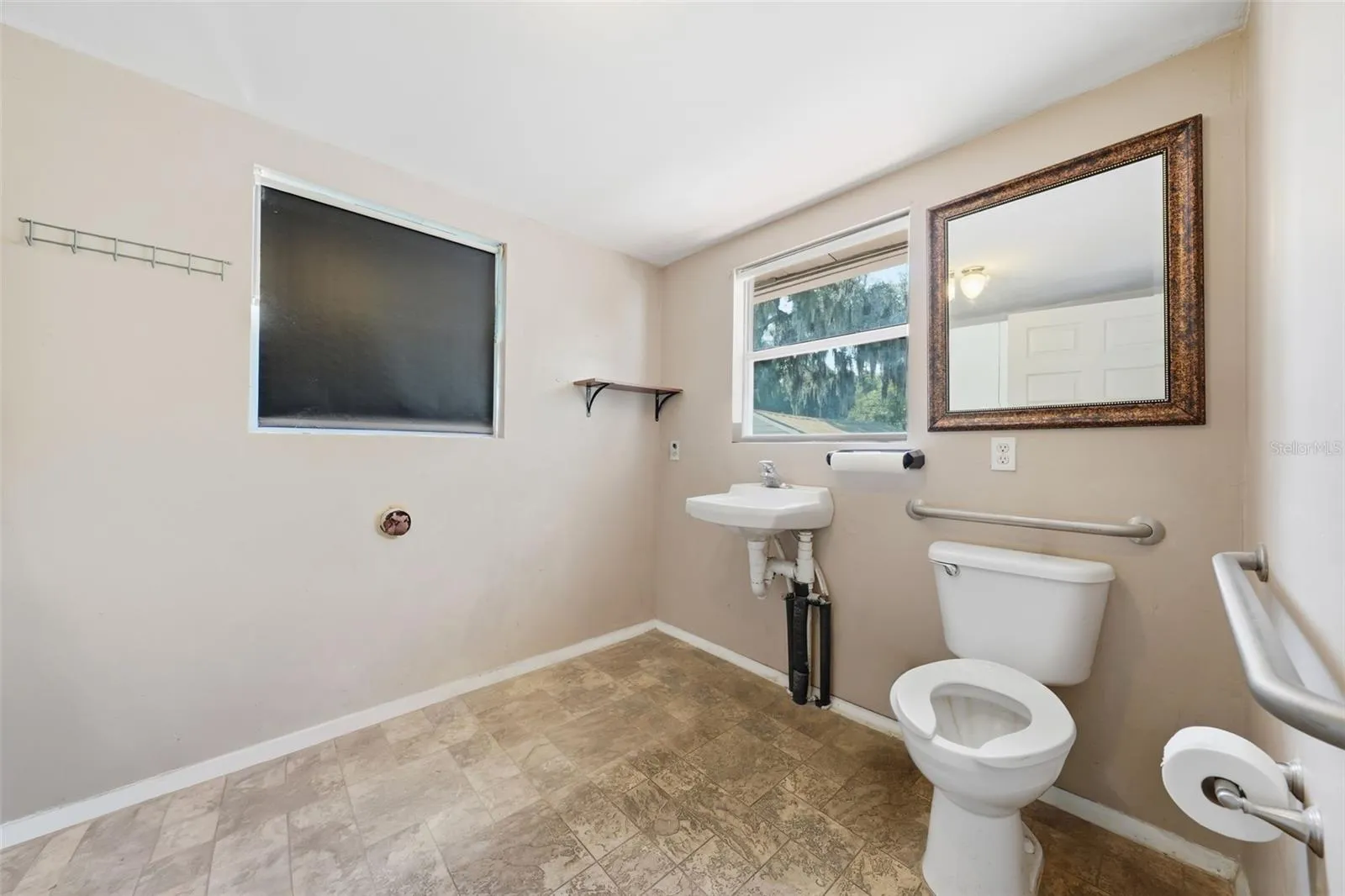 handicap accessible half bath/laundry room (off living/sitting area