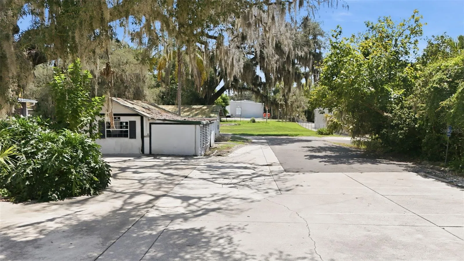 parking and vacant commercial lot in rear