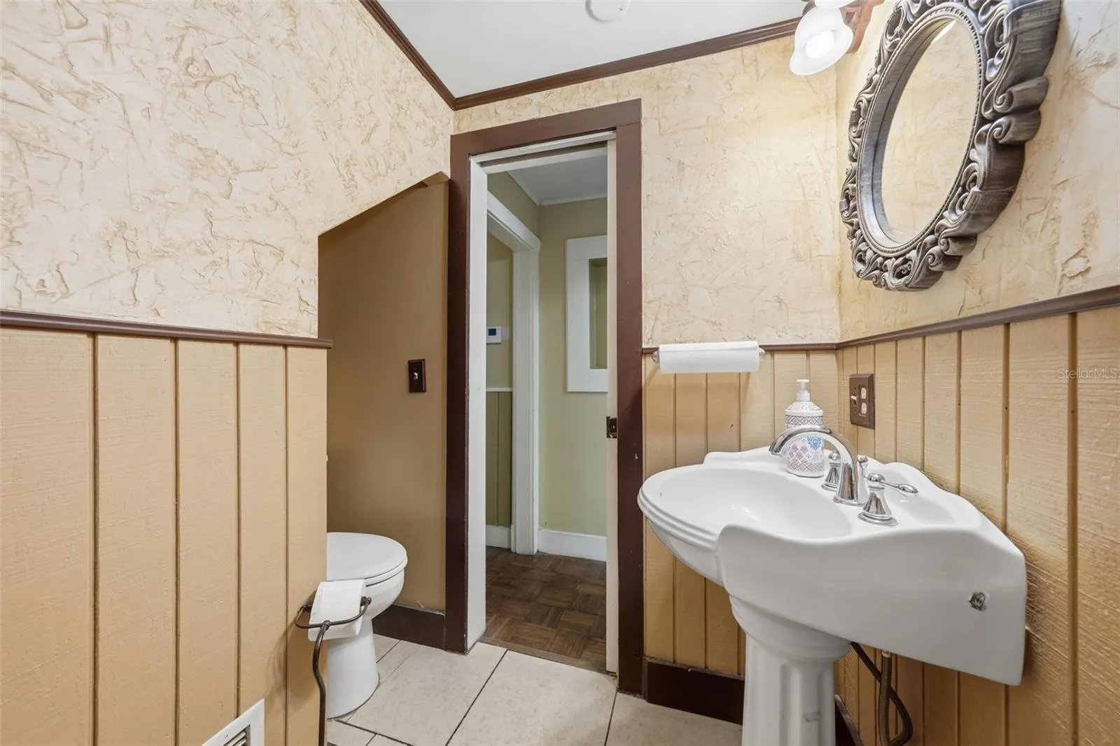Half bath between Bdrm 1 downstairs and foyer area