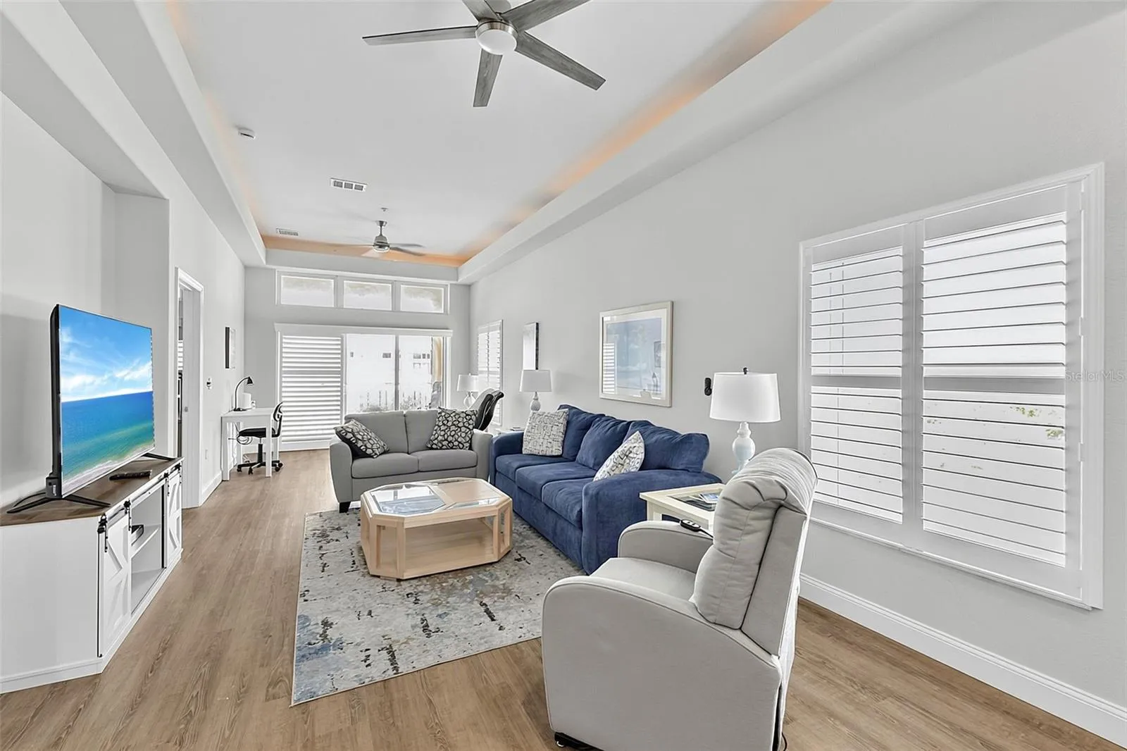 Great room with living and sitting space as well as a desk