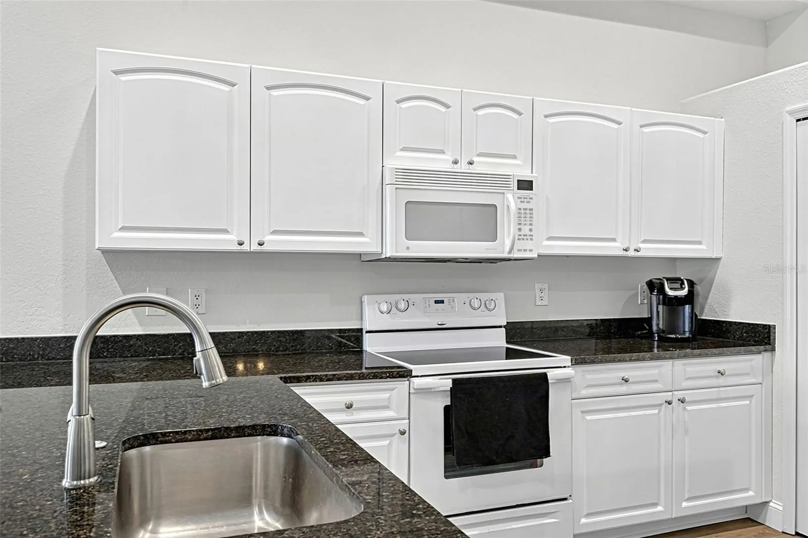 Granite countertops and refurbished cabinets