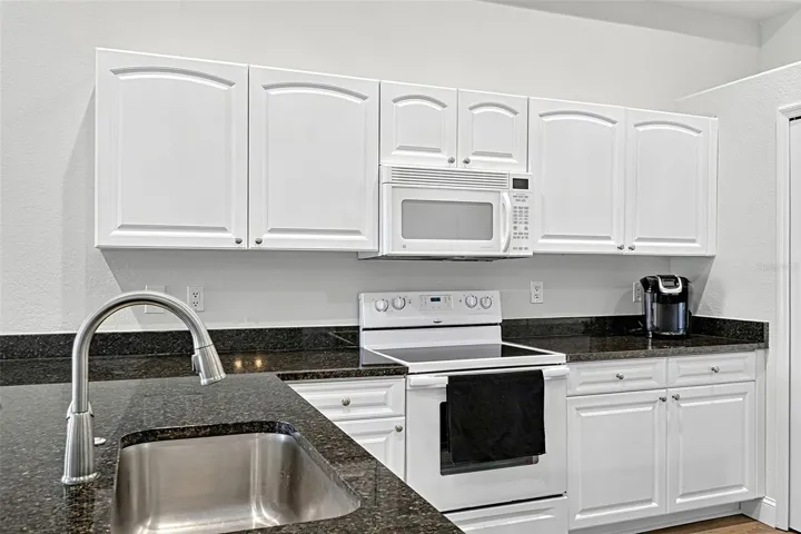 Granite countertops and refurbished cabinets