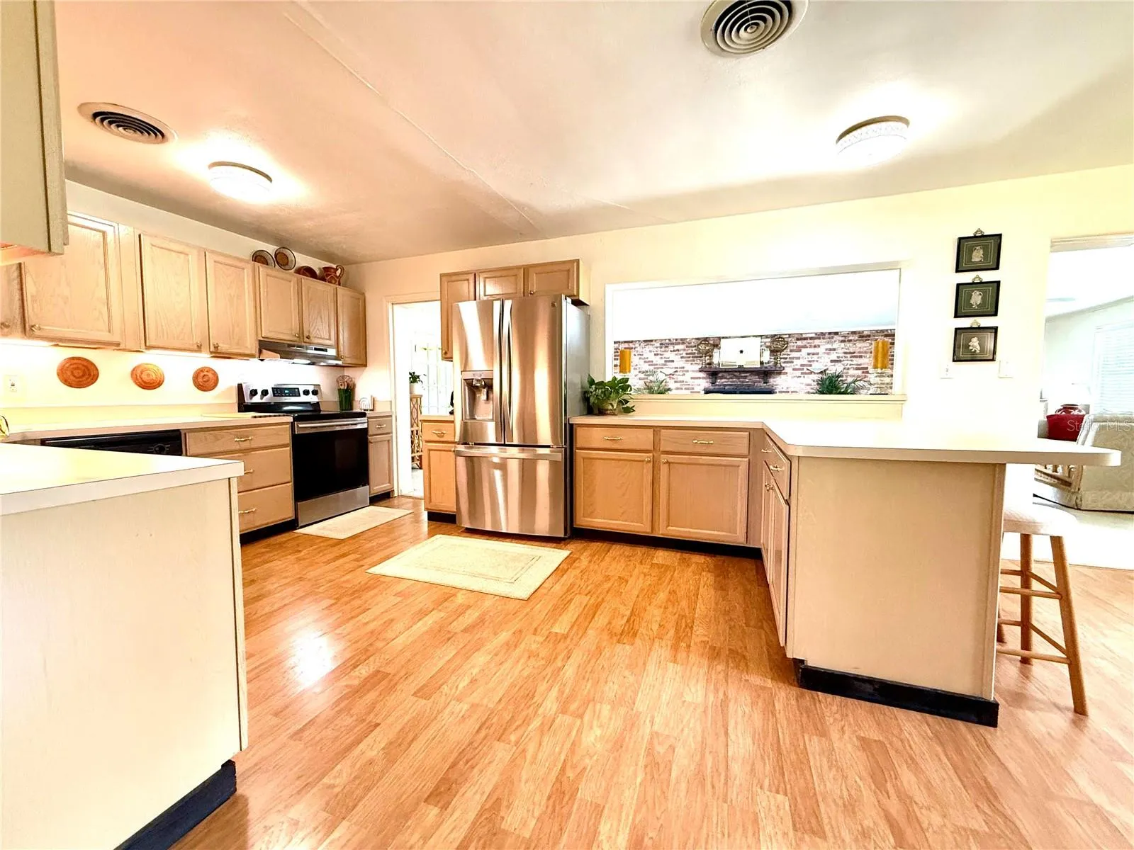 View of kitchen & living room from foyer