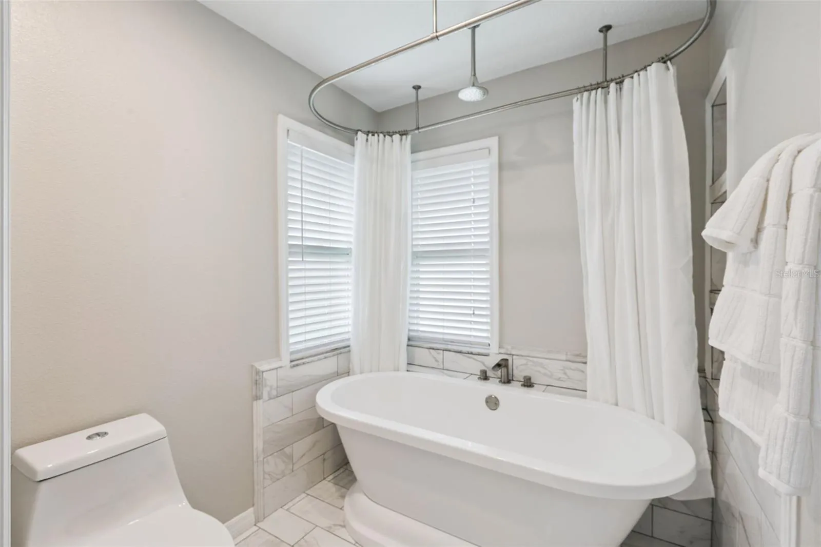 You'll feel like you're in a spa in this wonderful custom bath with deep tub and rainfall showerhead.