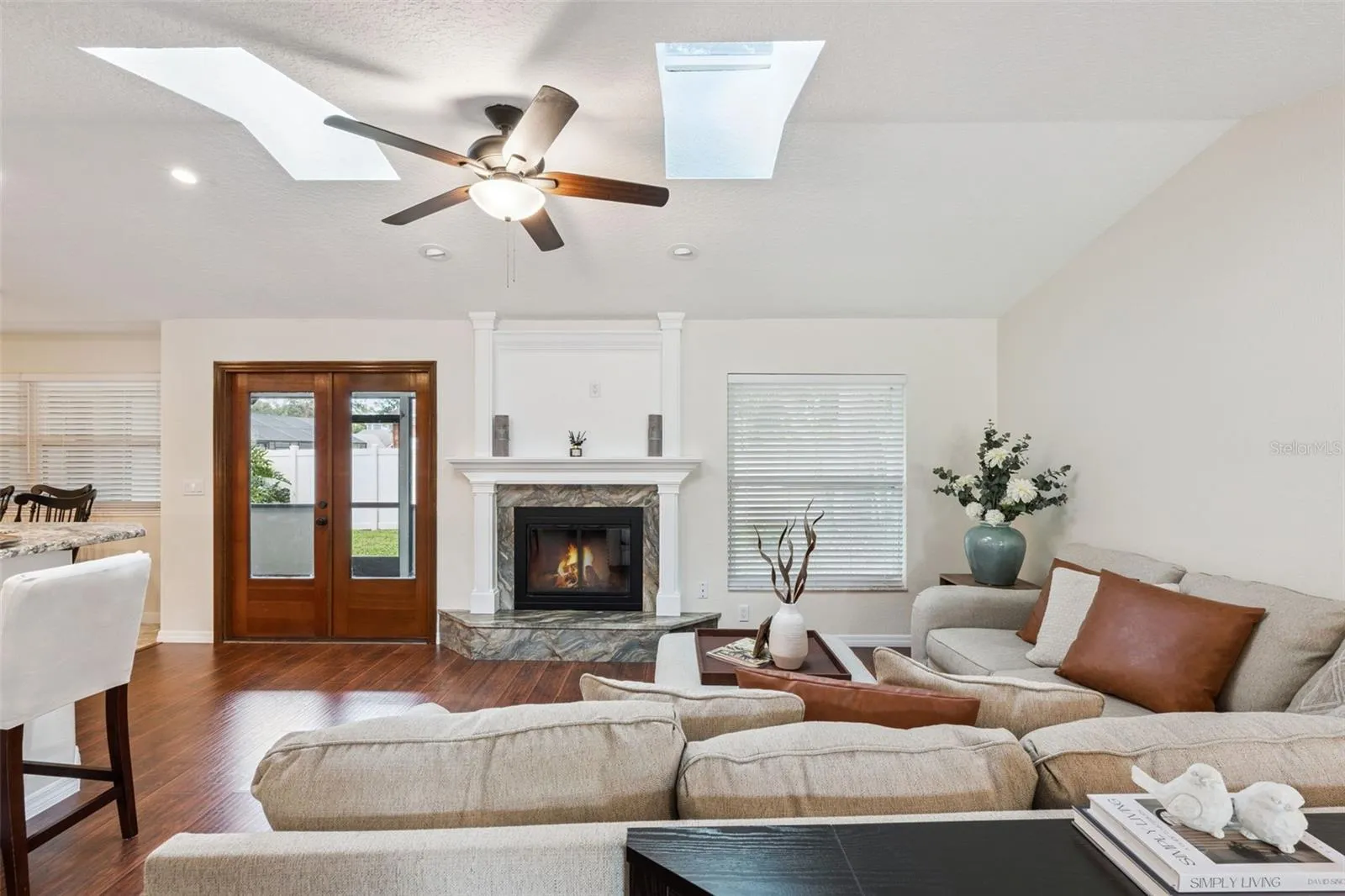 skylights provide wonderful natural light to this cozy living room.