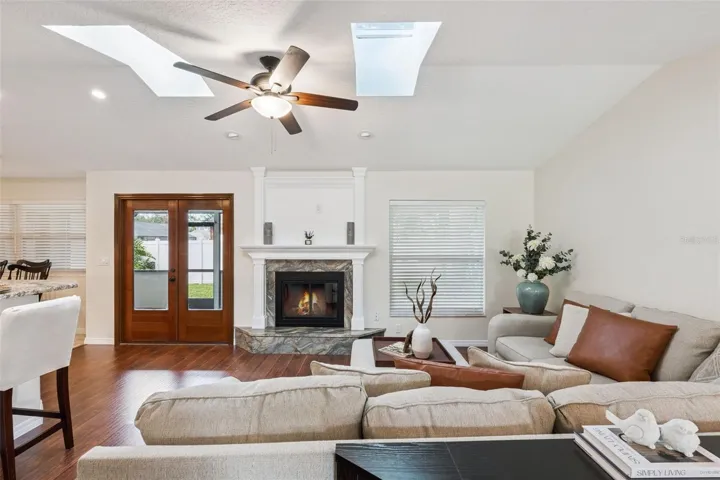skylights provide wonderful natural light to this cozy living room.
