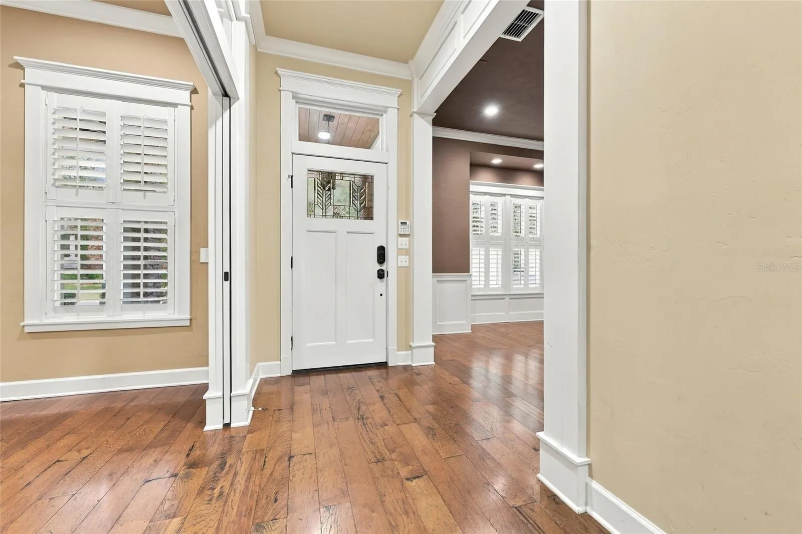 Front foyer: Wood floors in foyer, dining room, study, kitchen, living room &amp; primary bedroom