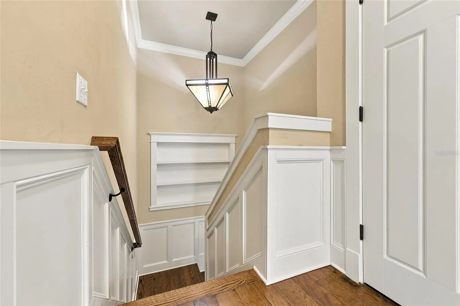 Landing to downstairs: custom paneling on stairs
