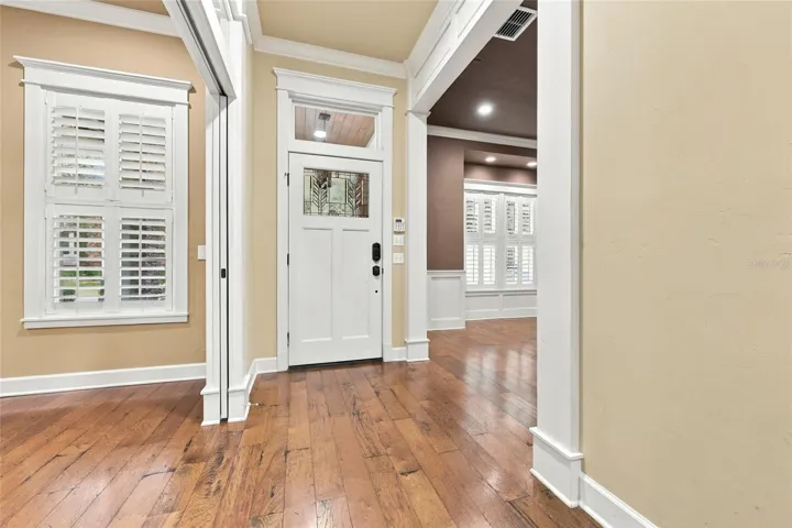 Front foyer: Wood floors in foyer, dining room, study, kitchen, living room &amp; primary bedroom