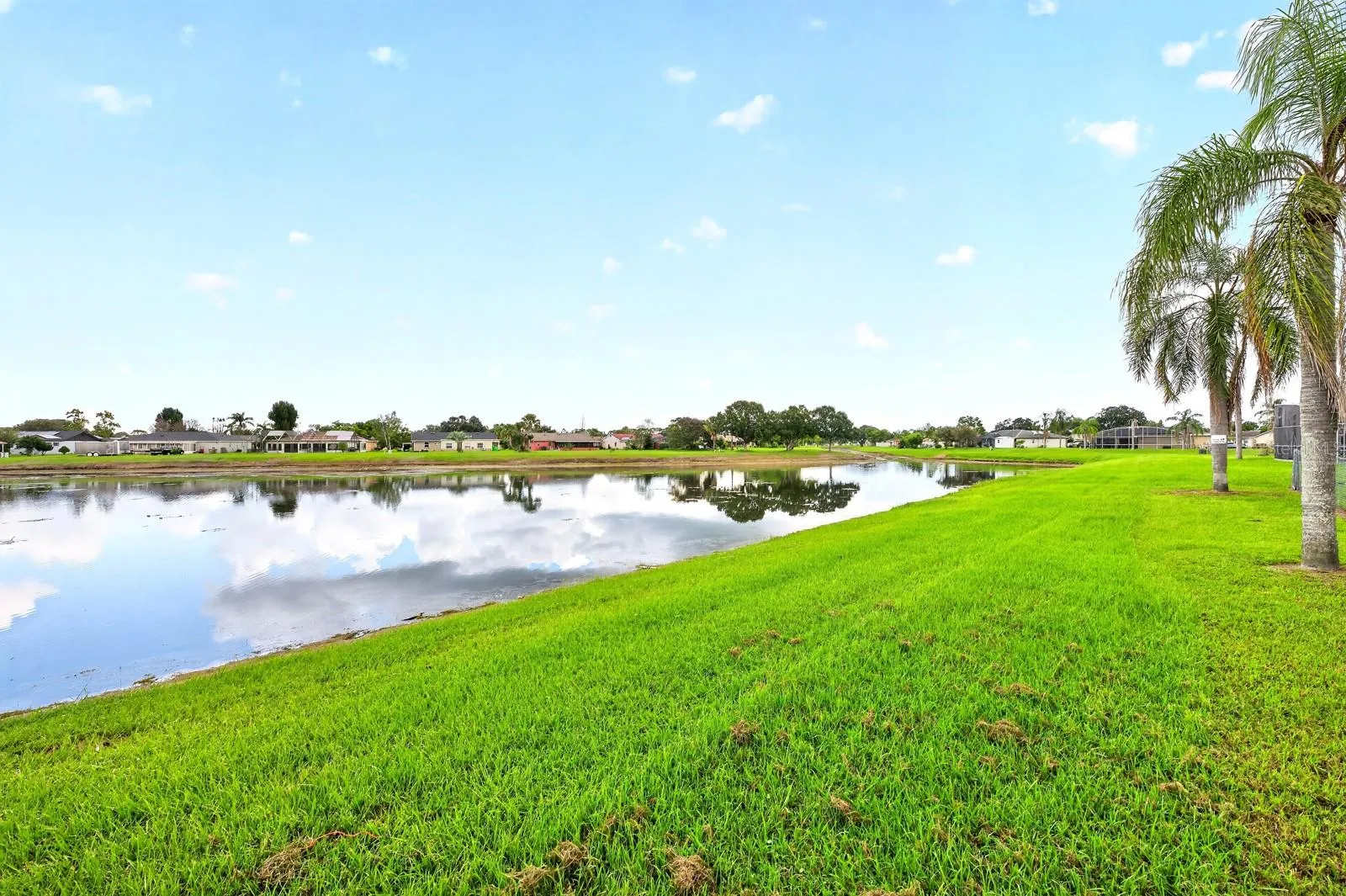 The CORNER-LOT SETTING AND POND VIEW add to the home's sense of space and tranquility.