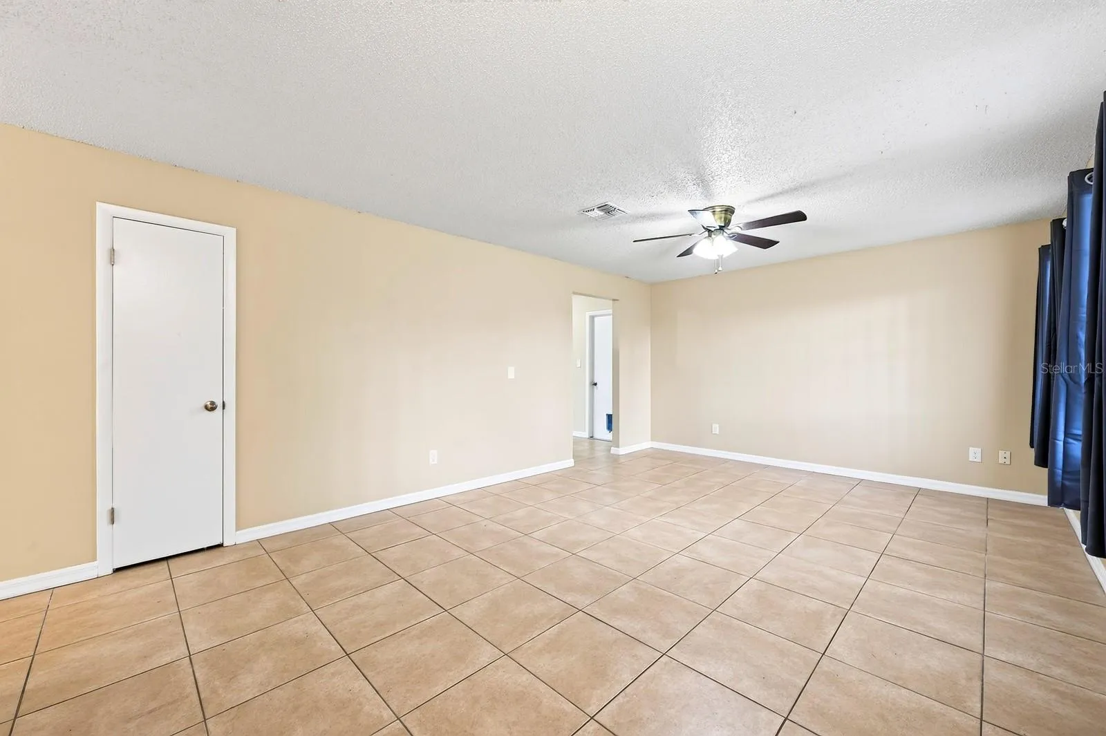 Step inside to a generous Living Room filled with NATURAL LIGHT and a welcoming sense of space.