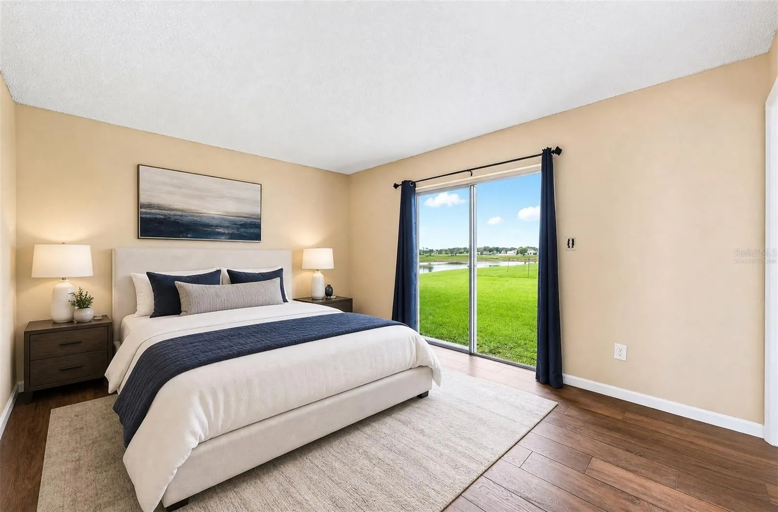 The spacious Primary Bedroom includes sliding glass doors that open directly to the backyard, bringing in plenty of NATURAL LIGHT and creating EASY ACCESS to the outdoor space. Virtually Staged