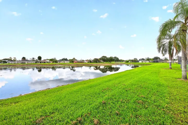 The CORNER-LOT SETTING AND POND VIEW add to the home's sense of space and tranquility.