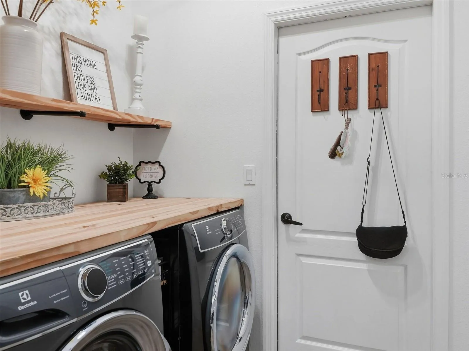 Butcher block counter and shelving in the laundry room.