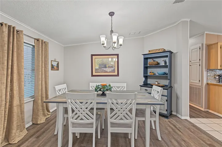 This table and China cabinet stays with the home.