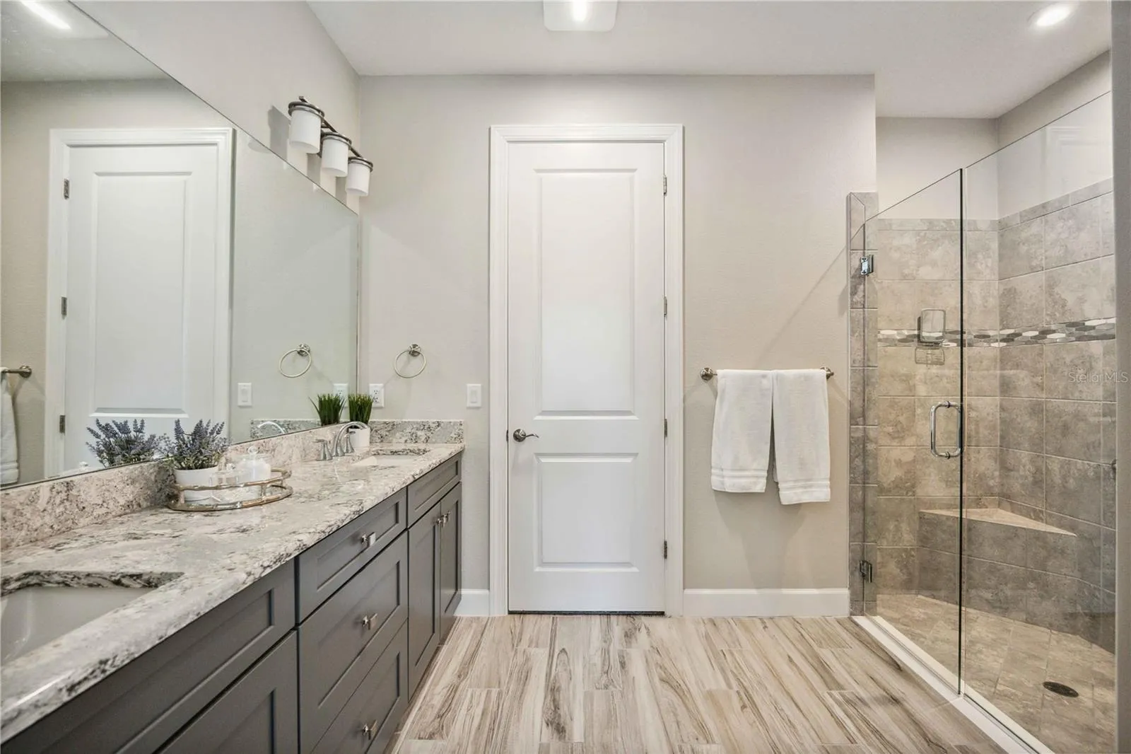Twin vanities, frameless shower &amp; large walk-in closet.