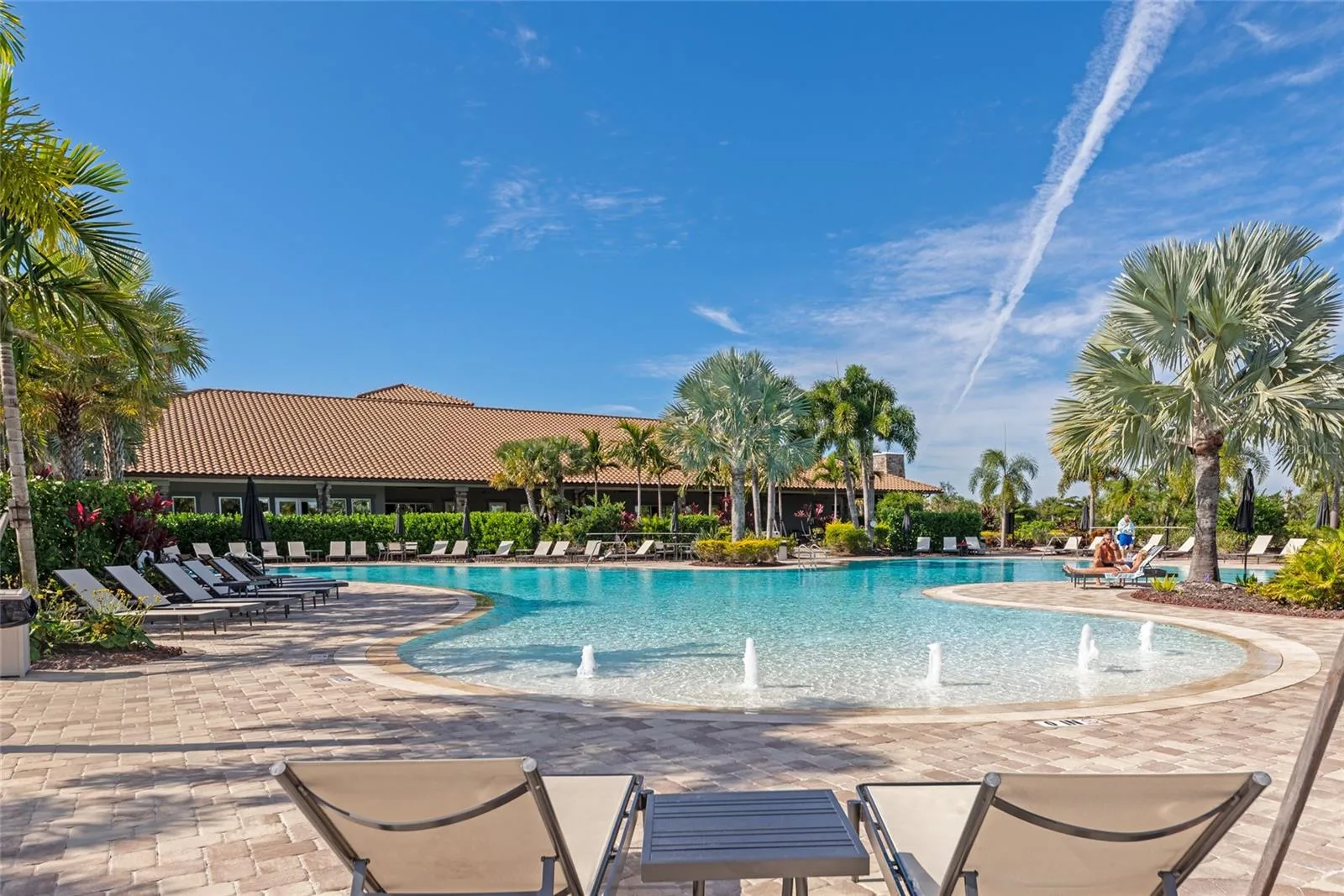 Resort pool w/ swim lanes &amp; beach entry.