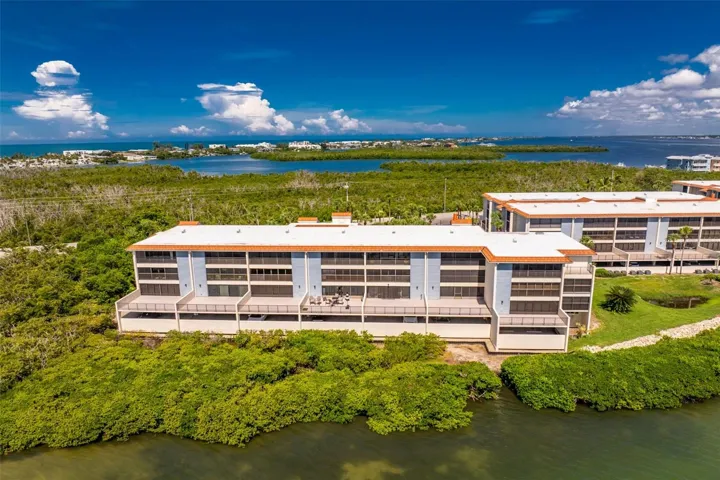 Building is closest to the water.