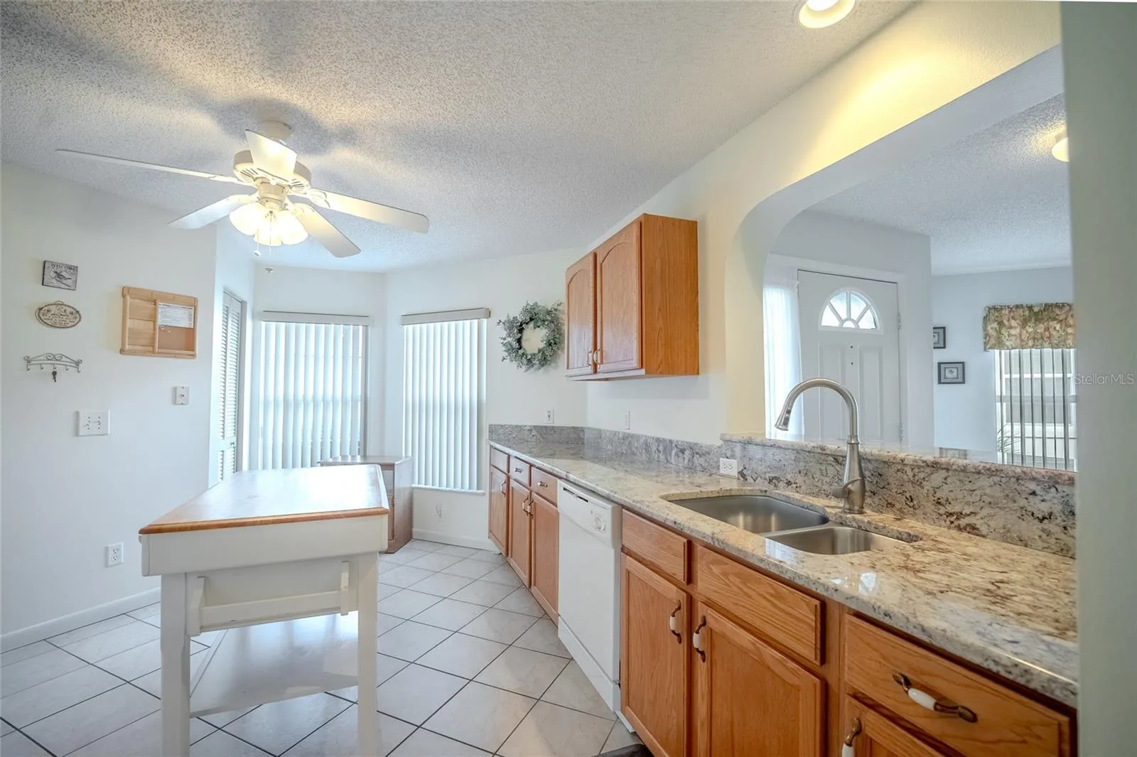 Granet counter tops with opening overlooking the Great Room.