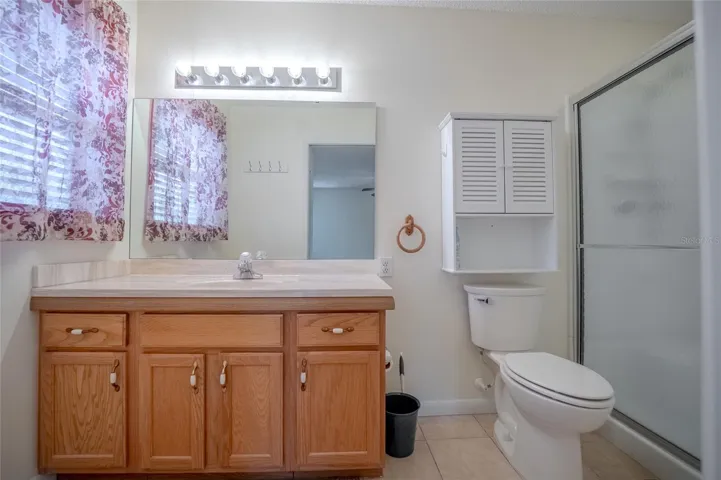 Primary bathroom with solid counter top.