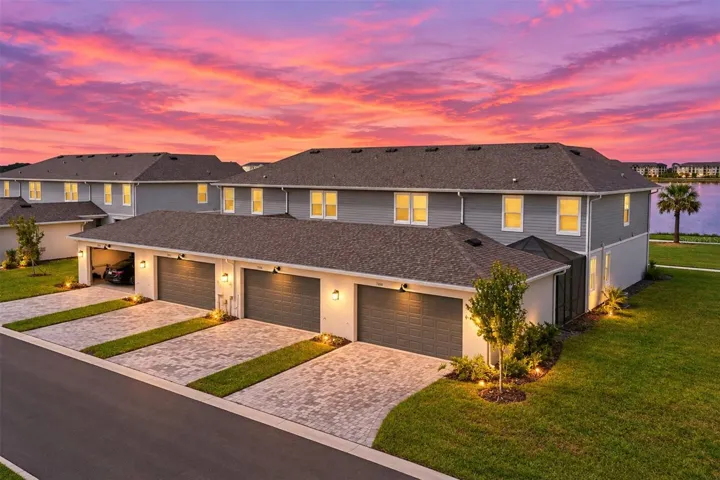 2- car garage with epoxy flooring and paver driveway