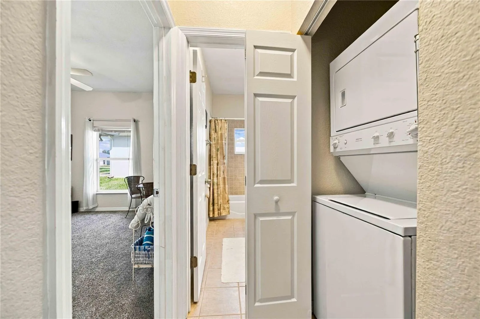 Convenient stackable washer and dryer located in the laundry closet.