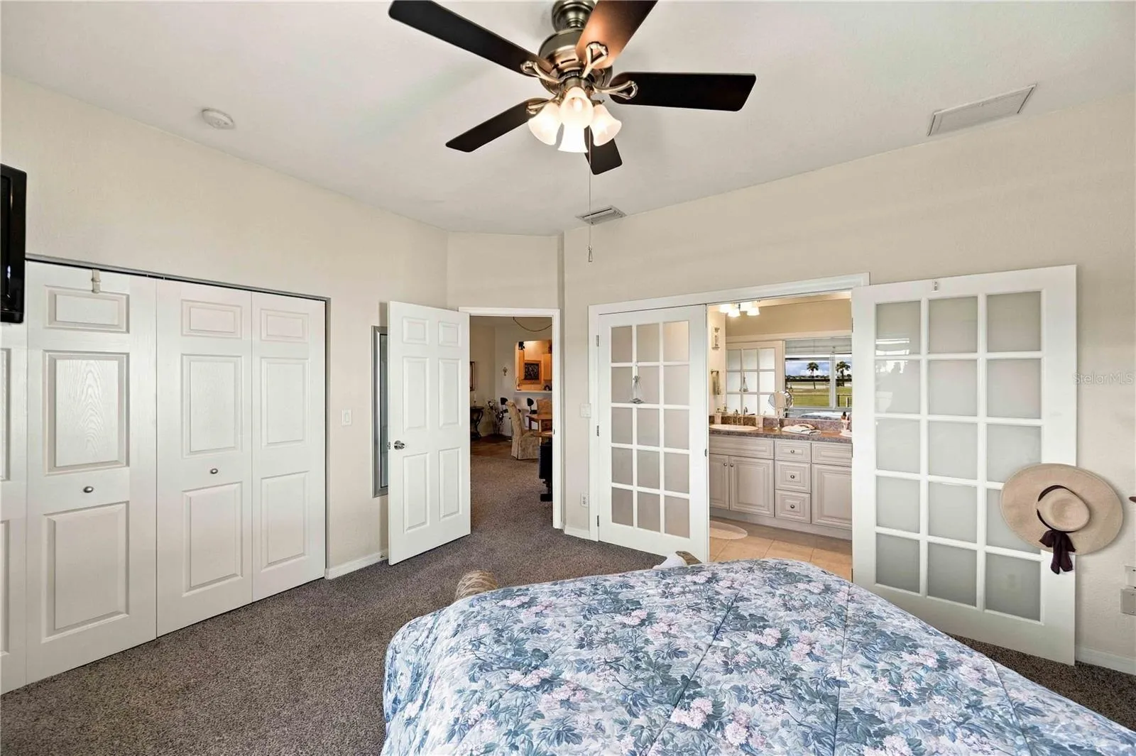 Beautiful French doors leading into a well-appointed ensuite.