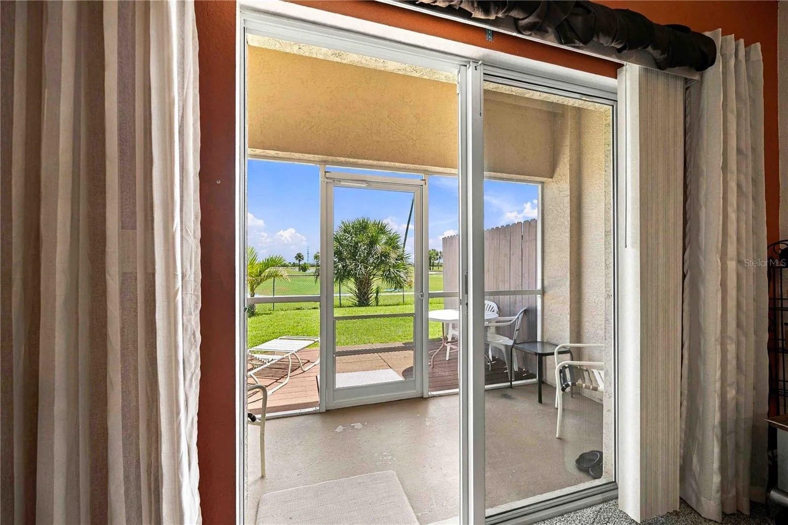 Relax on the back porch or inside the screened-in lanai, which offers a picturesque view of the 16th hole at The Cove of Rotonda Golf Center.