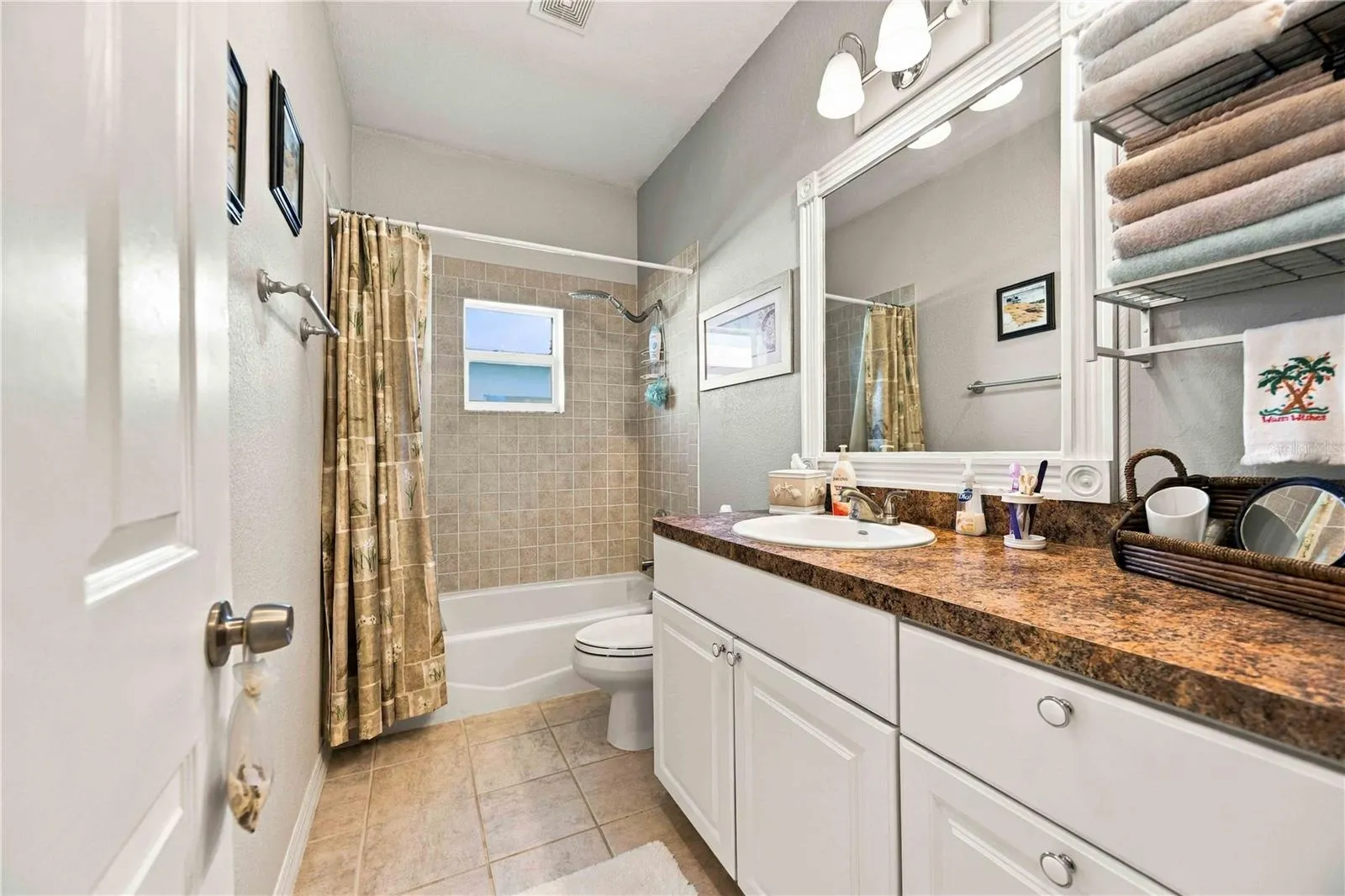 Main bathroom featuring a shower and bathtub combination.