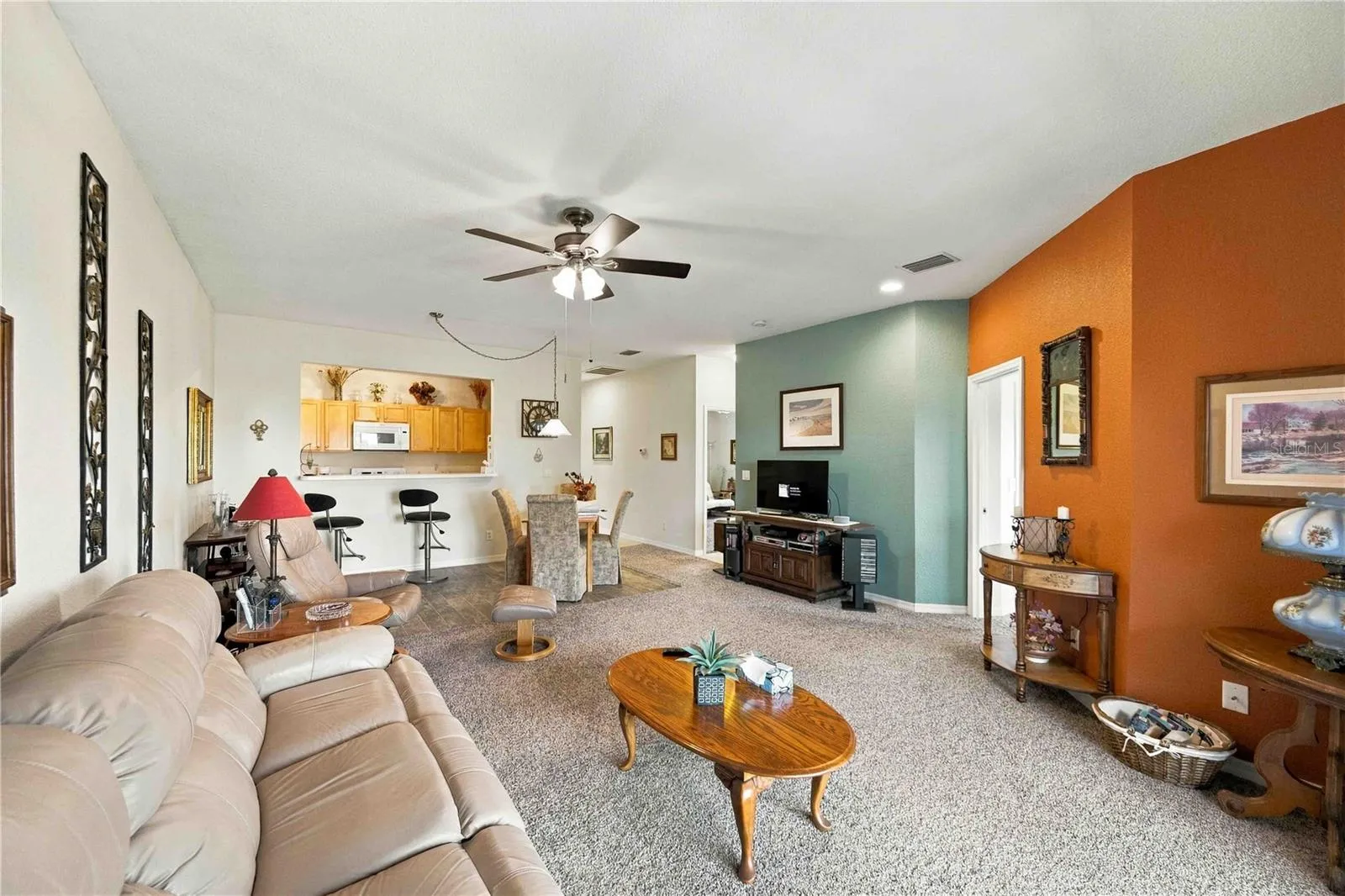 This comfortable and relaxing living space features an inviting layout and plenty of natural light, perfect for unwinding after a long day.
