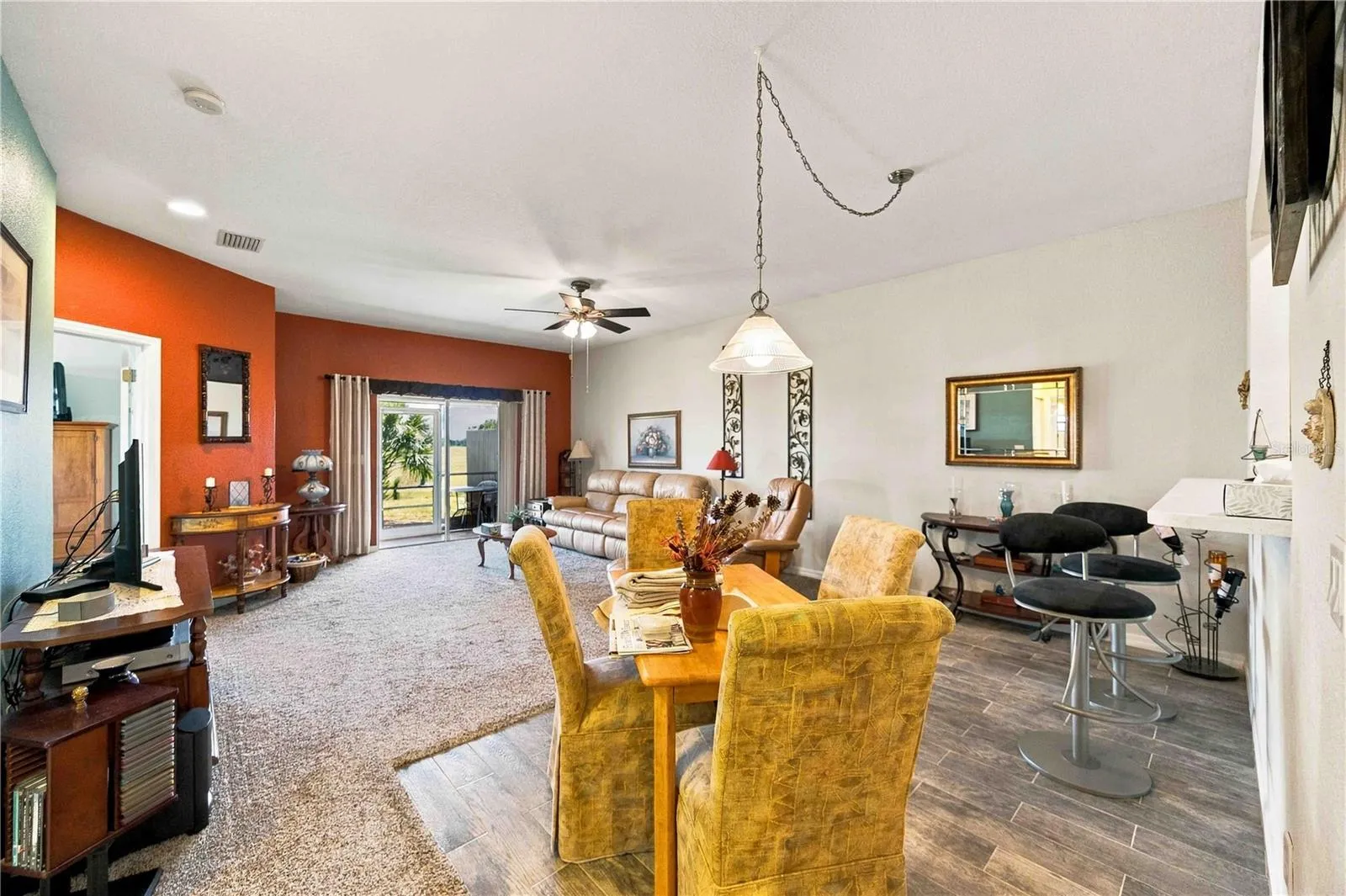 Bright, open-concept living area with ample natural light, perfect for both relaxing and entertaining.