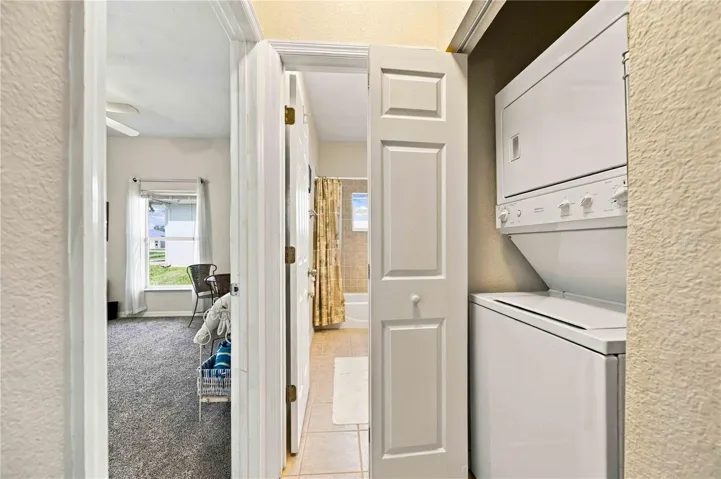 Convenient stackable washer and dryer located in the laundry closet.