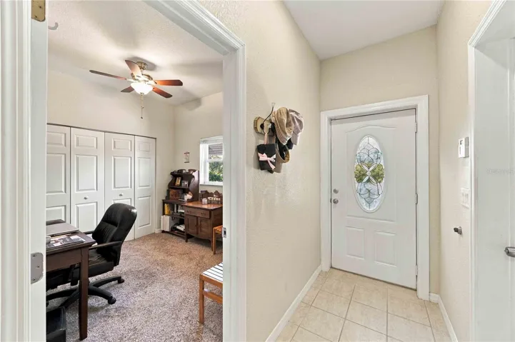 Foyer entry leading into a flexible floor plan that features three spacious bedrooms plus a dedicated office or bonus room, offering exceptional versatility for your lifestyle needs.