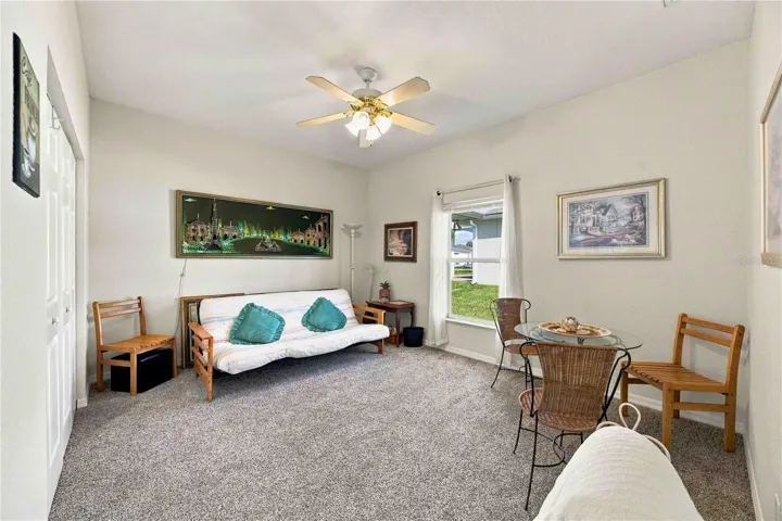 Spacious second bedroom featuring a ceiling fan.