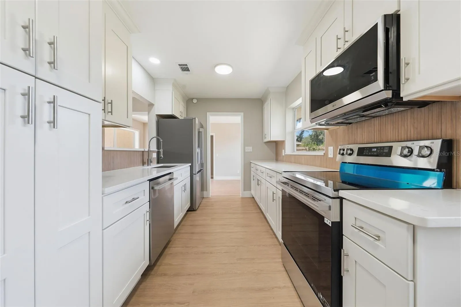 Kitchen with solid wood soft close cabinetry and stainless steel appliances