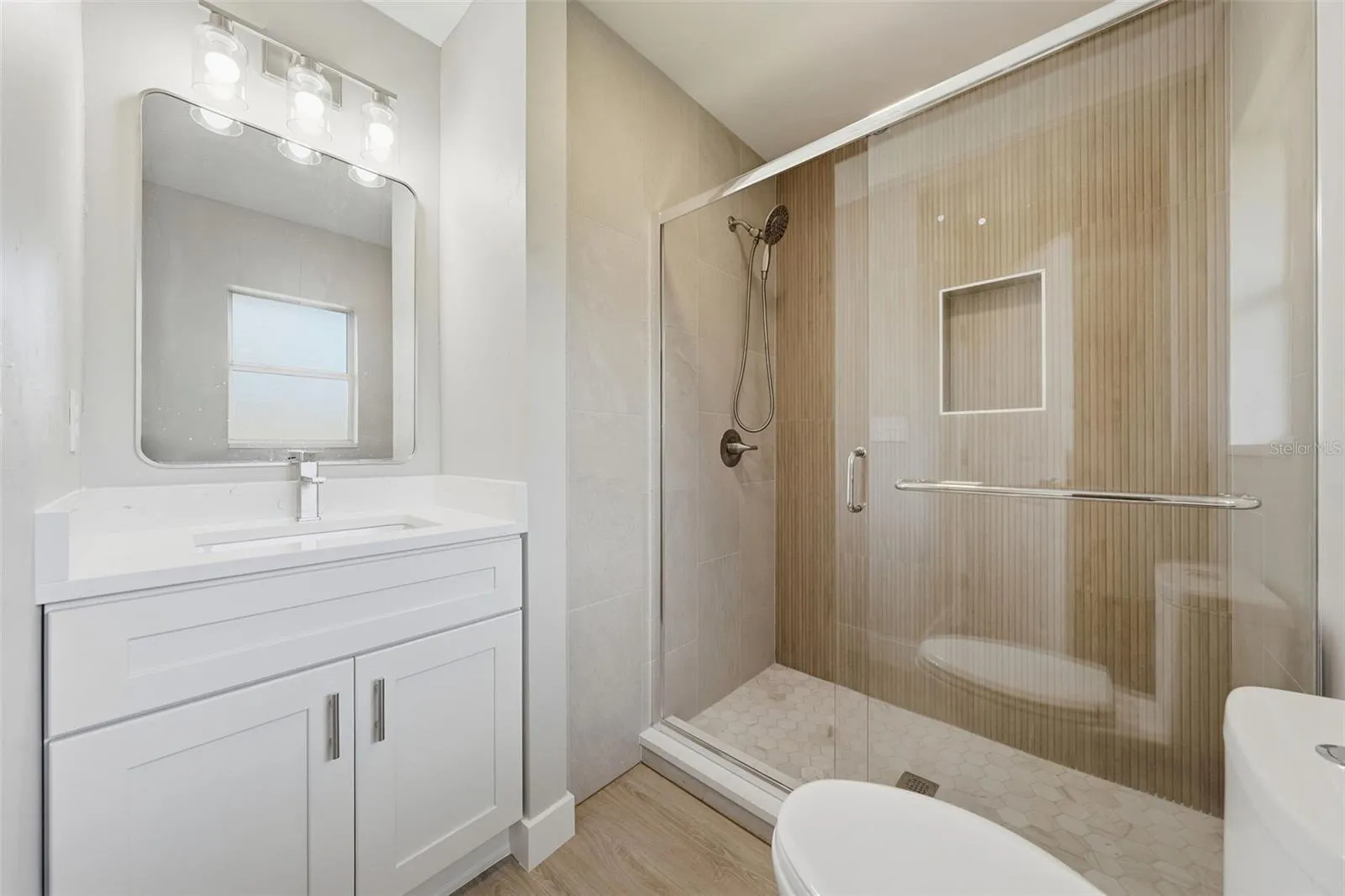 Bathroom with solid wood soft close vanity and quartz countertop