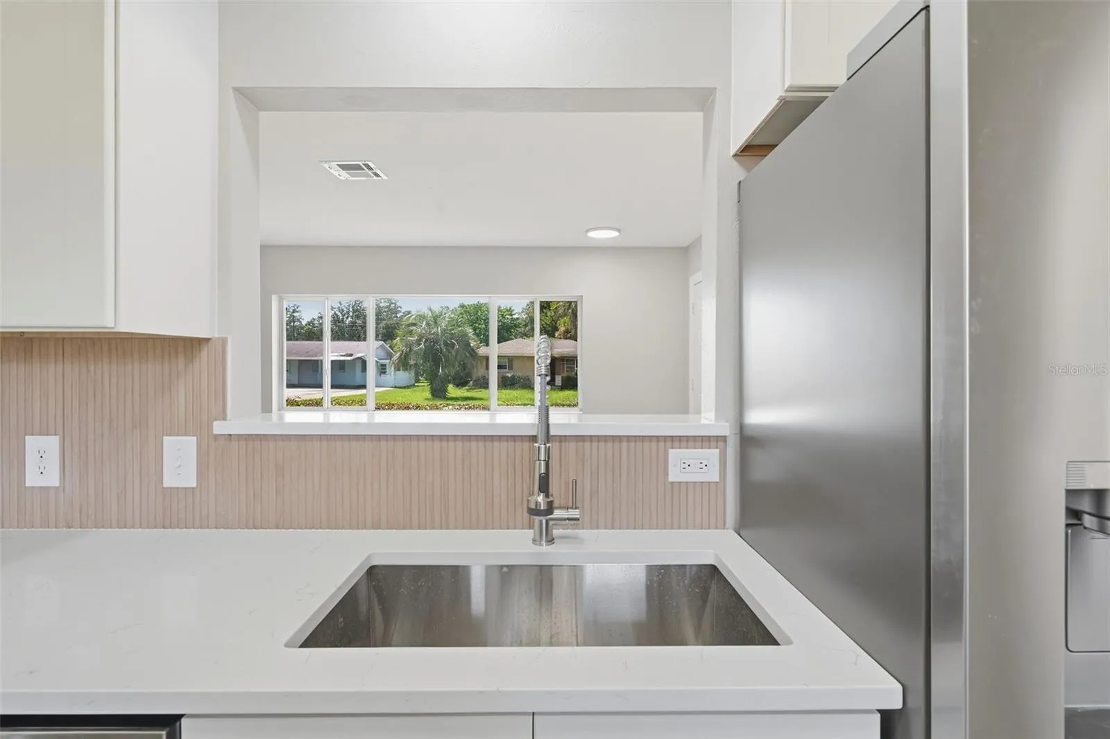 Stainless sink under the pass-through window
