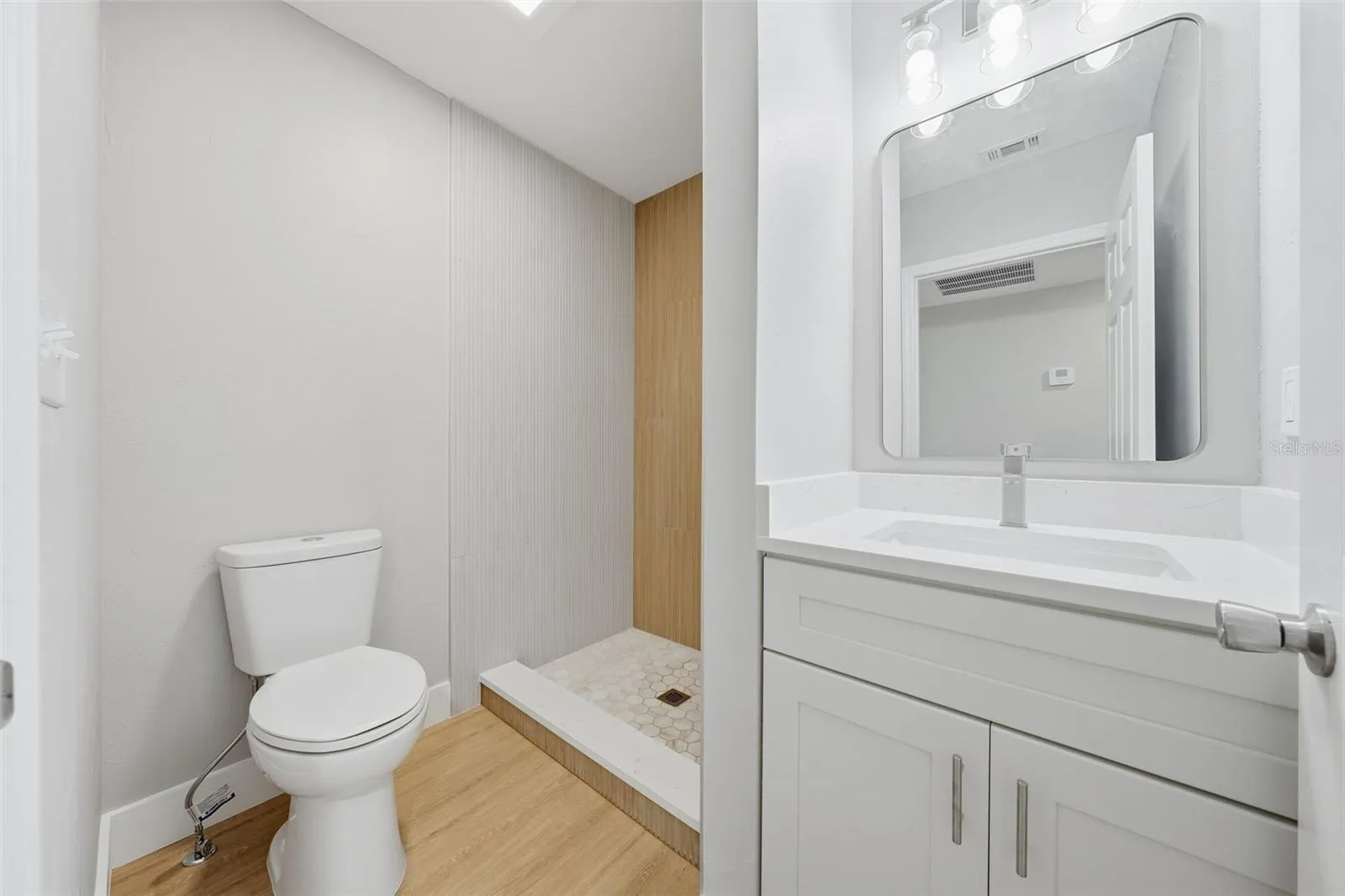Second bathroom with solid wood soft close vanity and quartz countertop