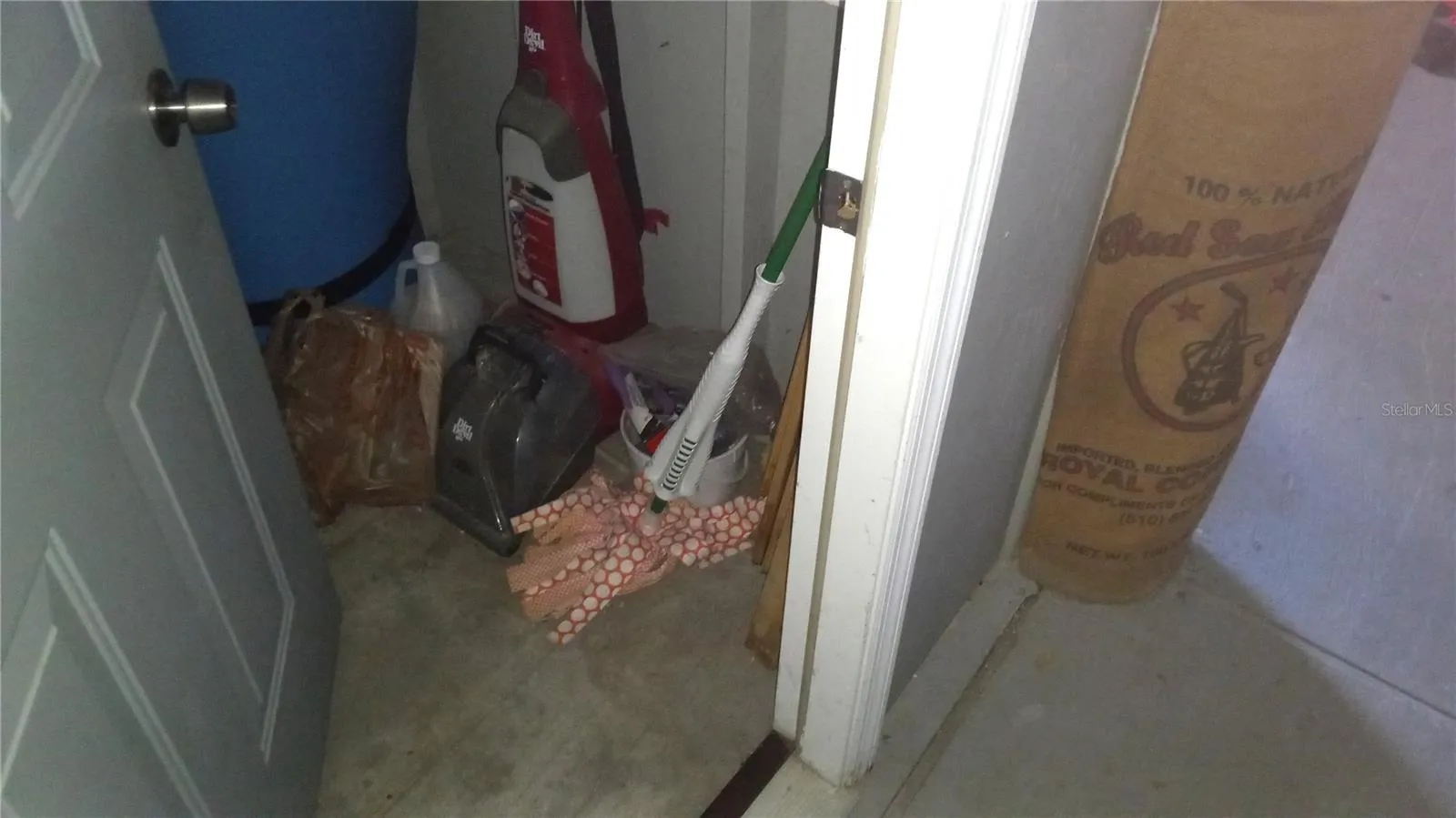 Owners storage closet under the stairs